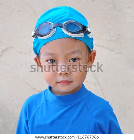 Portrait of a Three years old boy with swimming accessories