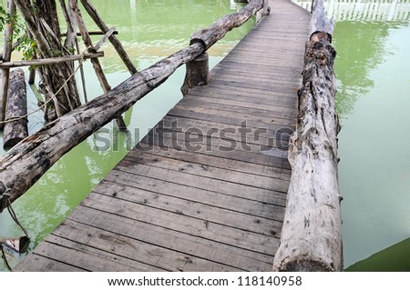 Wood path over pond in the park