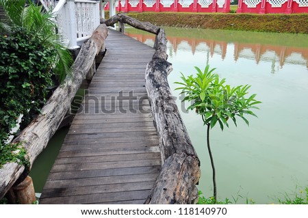 Wood path over pond in the park