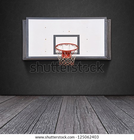 Basketball board on blackboard background with ground of the wood
