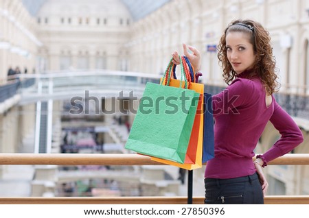 young woman with color bags