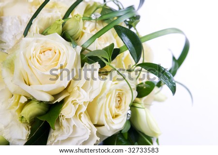 Wedding bouquet with cream roses and green decoration
