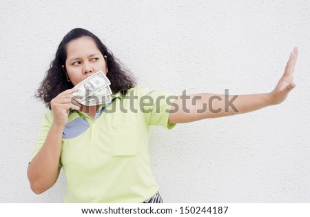 cash on woman hand close her mouth with stop hand