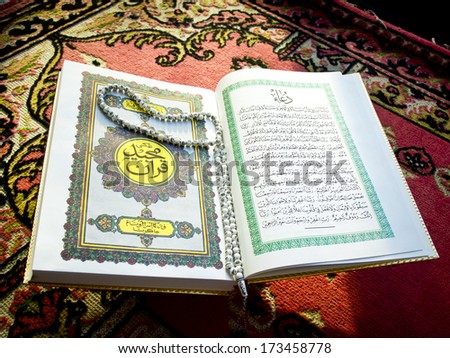 Prayer beads on the Koran