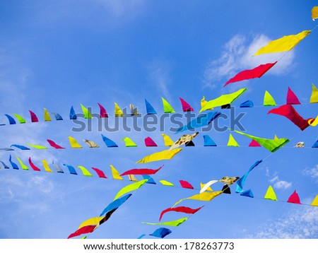Bunting Flags Blowing in the Wind Against A Blue Sky