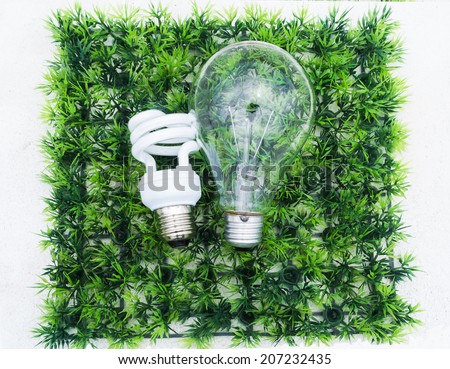 light bulb in different size on artificial green grass