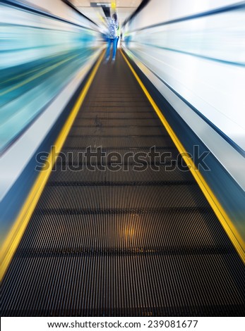 escalator leading forward, abstract motion blur