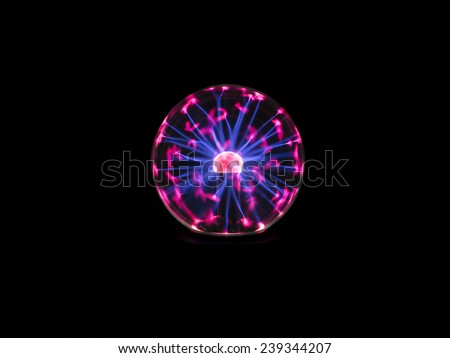 electric spark on plasma ball , the high voltage supply to inner electrode then electrons discharge through low pressure gas to outer sphere