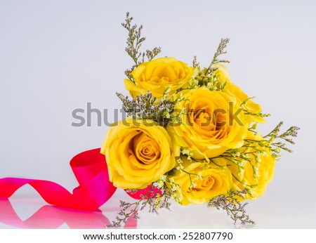 beautiful yellow rose on white grey