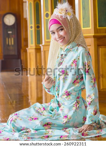 young asian muslim woman in full decorated dress, muslim culture with hijab on her head
