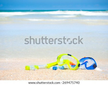 dive equipment on white sand beach in the sea shore