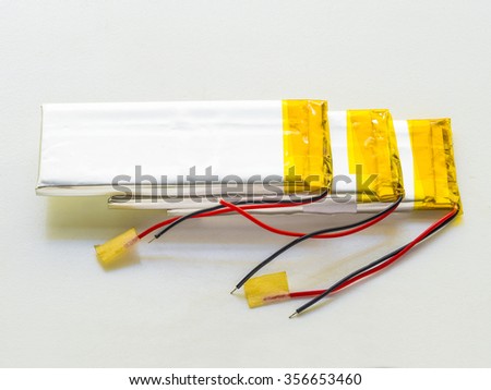 stack of used lithium-iron battery with wire, the battery removed from mobile phone
