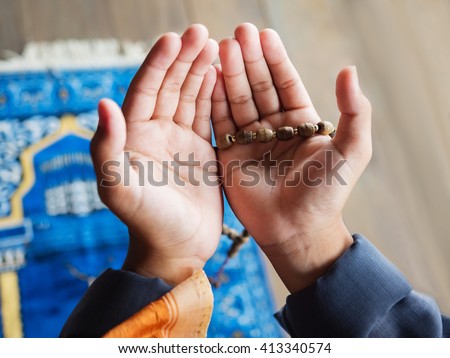 hands of muslim child praying for Allah, muslim God