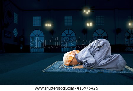 muslim child worshiped Praying for Allah, muslim God, prostrate on the mosque floor background
