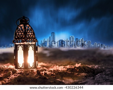 lighting with candle inside Lantern shining on sand floor playground, children play with it in Ramadan night, arabic style lantern, vintage lantern