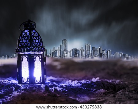 blue light Lantern shining on sand floor playground, children play with it in Ramadan night, also known and called as Ramadan Kareem Lantern
