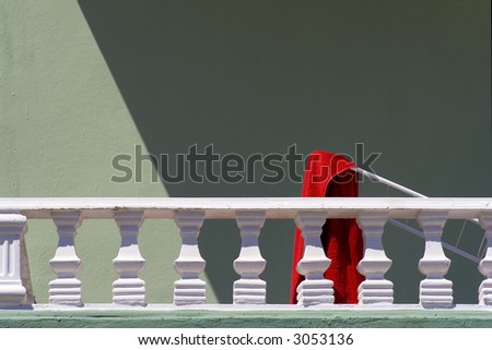 Red towel on dryer on balcony