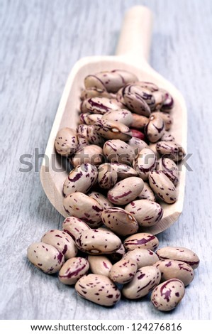 Pinto  beans in wooden spoon