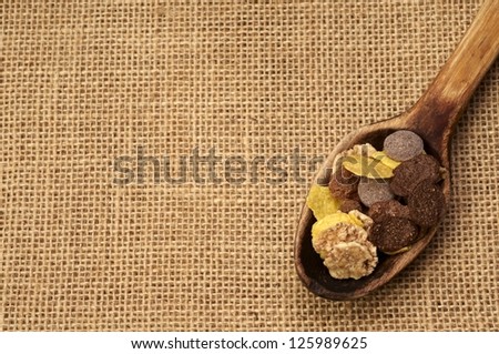 Chocolate muesli in wooden spoon