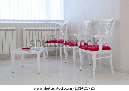 Modern interior with red chair and table-waiting room