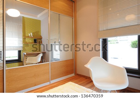 wardrobe and chair in bedroom