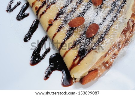 pancake with chocolate syrup and almond