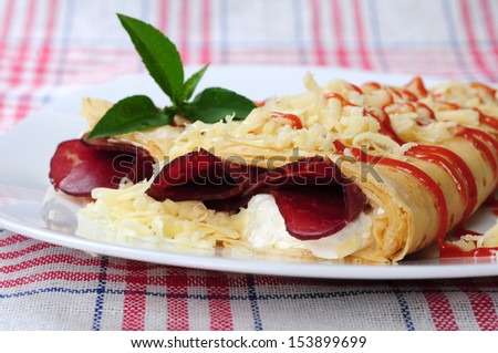 rolled pancakes stuffed cured ham and cheese