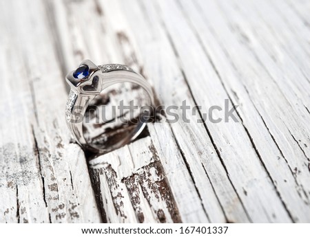 Wedding or Engagement Ring on wood
