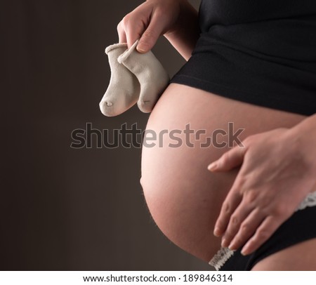 Close-up of pregnant woman tummy