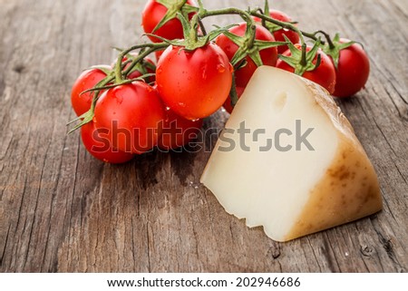 Piece of cheese and cherry tomatoes