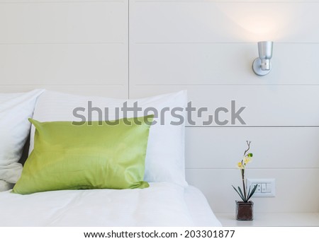 Cushions , green pillows on bed