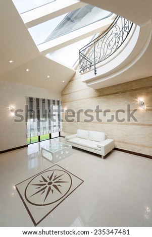 Modern apartment hall interior with white sofa