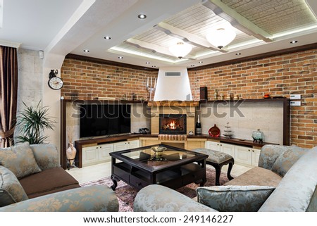 Interior of a modern spacious living room with fireplace