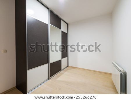 closet with sliding doors, drawer and shelves