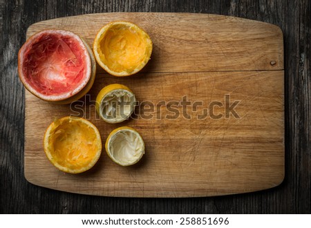 Fresh Squeezed Citrus fruit on Wood Background, Rustic Style.