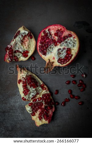 Luxurious pomegranate background. Pomegranate core on black background