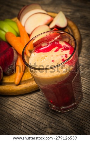 Glass of fresh beetroot, apple and carrot juice