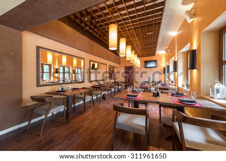 Restaurant room with wooden furniture