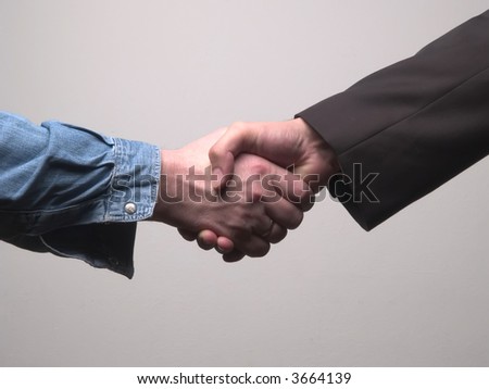 worker and businessman handshaking