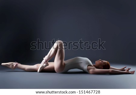 Image of gorgeous ballerina laying in studio