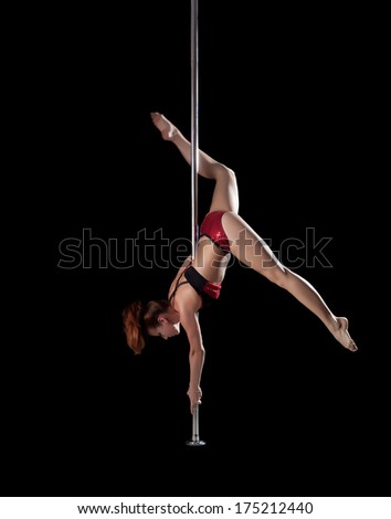 Sexy slim girl posing on pylon, upside down