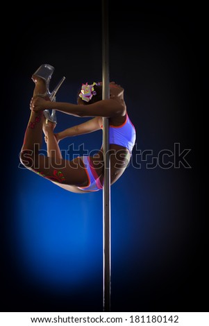 Image of seductive pole dancer posing in jump