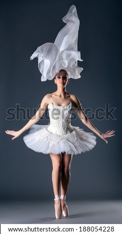 Lovely young ballet dancer posing in studio