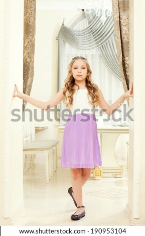Smartly dressed proud girl posing in restaurant