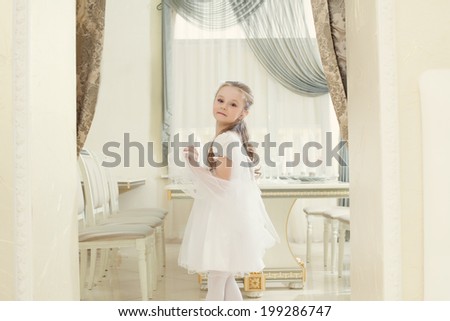 Adorable little girl posing in restaurant