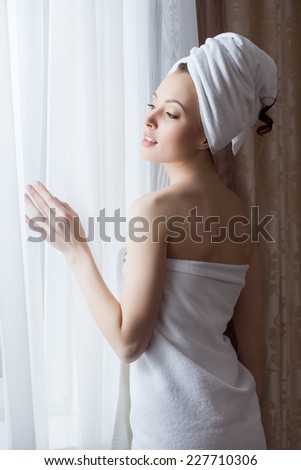 Portrait of sensual woman posing after shower