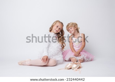 Lovely little ballerinas posing in studio