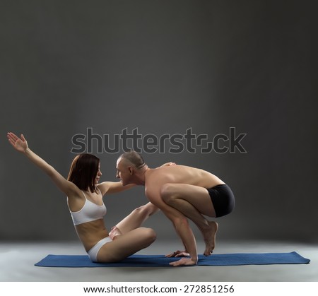 Yoga. Image of trainers posing in difficult asana
