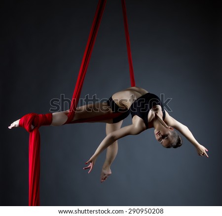 Image of elegant girl doing acrobatic trick