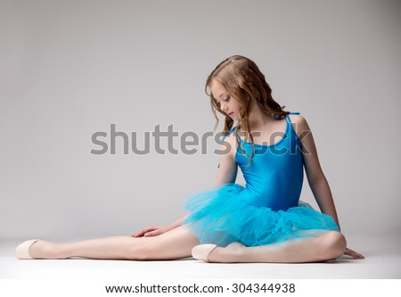 Nice little ballet dancer posing in studio